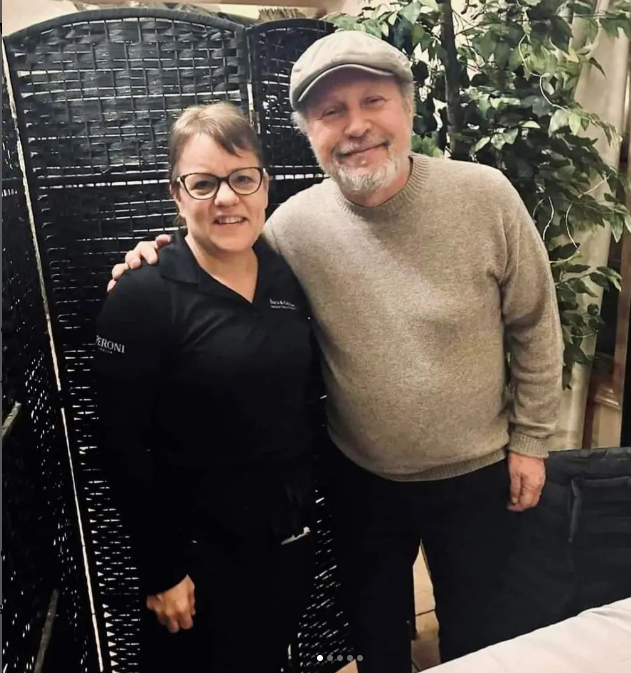 A man and a woman are posing for a picture together at Mama’s Cafe Baci