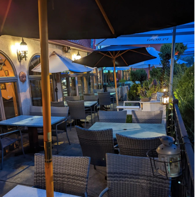Mama’s Cafe Baci restaurant patio with tables and chairs and umbrellas