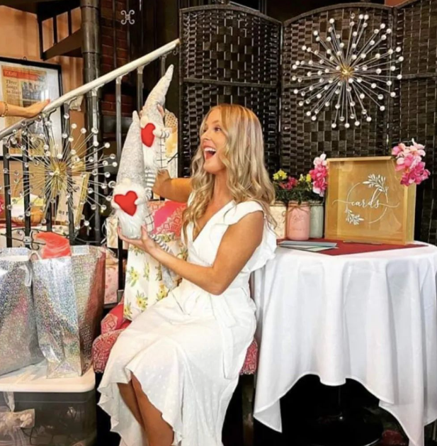 A woman in a white dress at her bridal party at Mama’s Cafe Baci