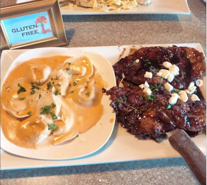 Two plates of food with a sign that says gluten free