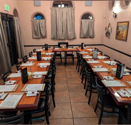 Mama’s Cafe Baci tables and chairs set up for a meeting