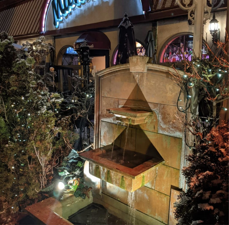A fountain in front of at Mama’s Cafe Baci