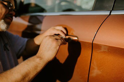 Home Lockout — Locksmith Repairing Door Lock in Bellevue, NE Home Lockout — Locksmith Repairing Door Lock in Bellevue, NE