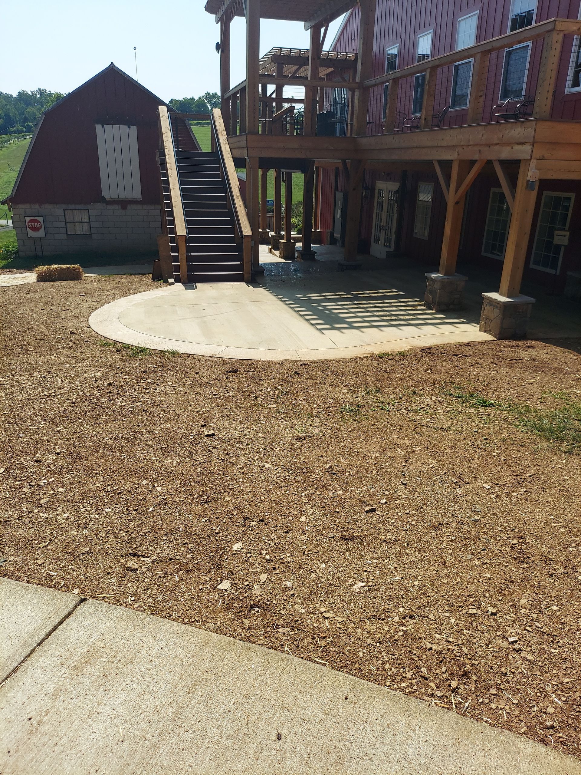 A large house with a wooden deck and stairs
