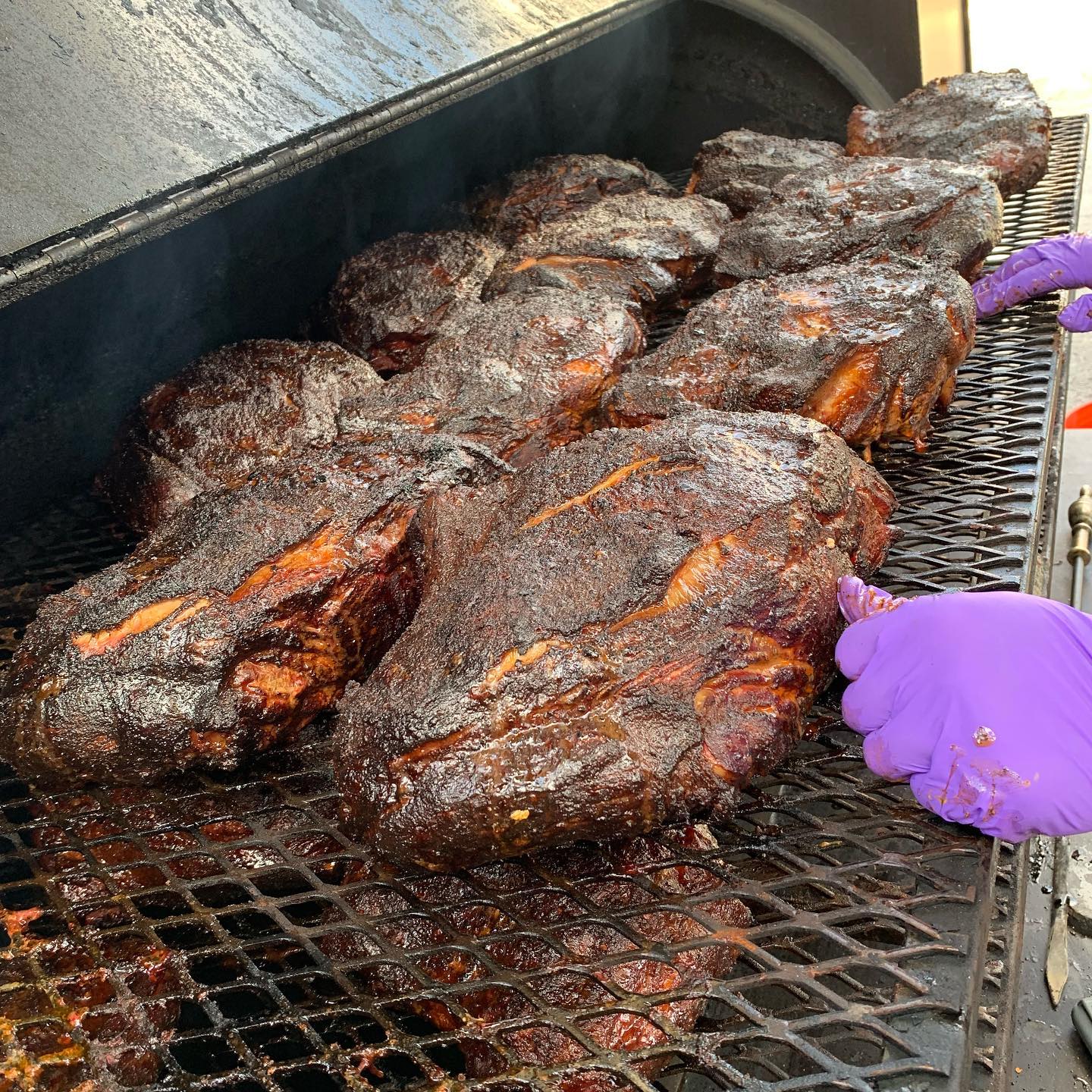 Gainesville BBQ — Man Holding a Tray with Sliced Meat in Gainesville, GA Gainesville BBQ — Man Holding a Tray with Sliced Meat in Gainesville, GA