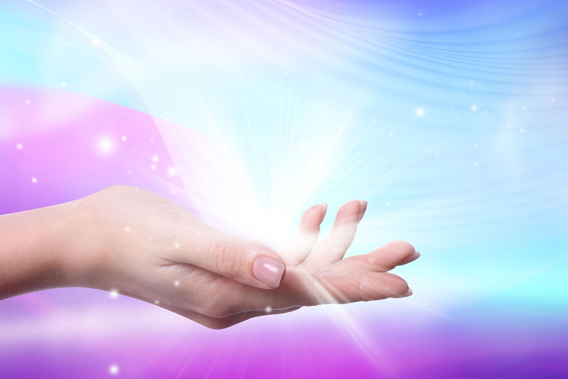 Hand reaching up, palm open, radiating bright light against a purple and blue blurred background.