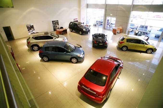 Elegant Red Car in Showroom — Cemak Constructions in Port Macquarie, NSW