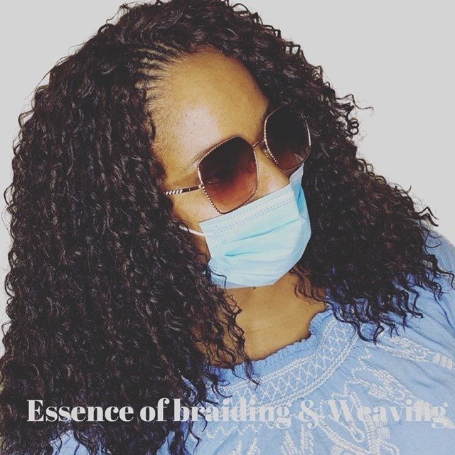A woman wearing a mask and sunglasses says essence of braiding & weaving