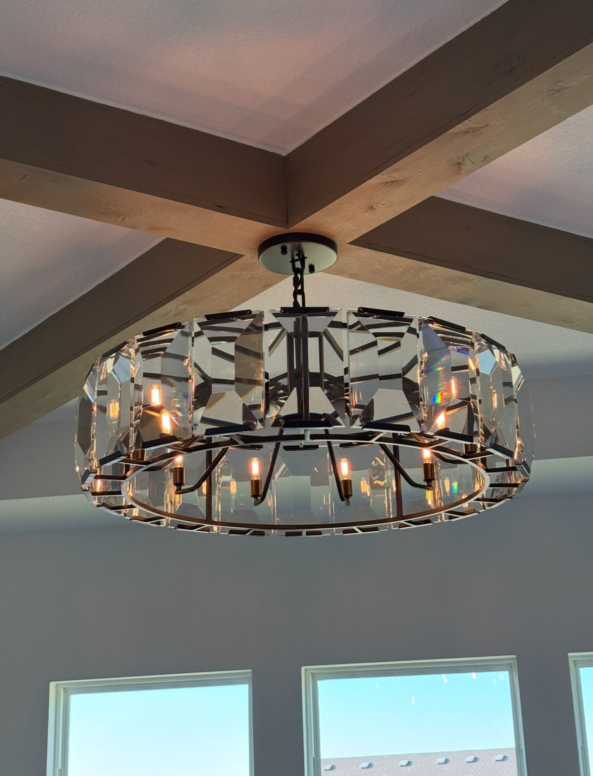 A large chandelier is hanging from the ceiling in a room.