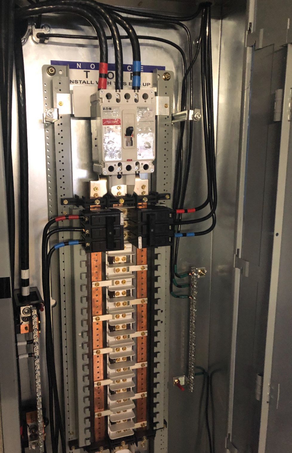 A electrical box with a lot of wires coming out of it