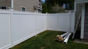 Fence in the process of being installed in Concord, NH
