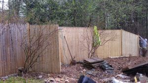 Fencing contractor working during fence installation service