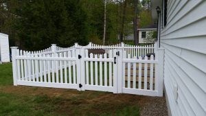 White picket fence blocking of area in Concord, NH