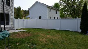 Tall fence surrounding Concord, NH property