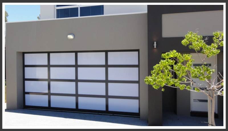 White garage door, tree in front — Designs in Taree, NSW