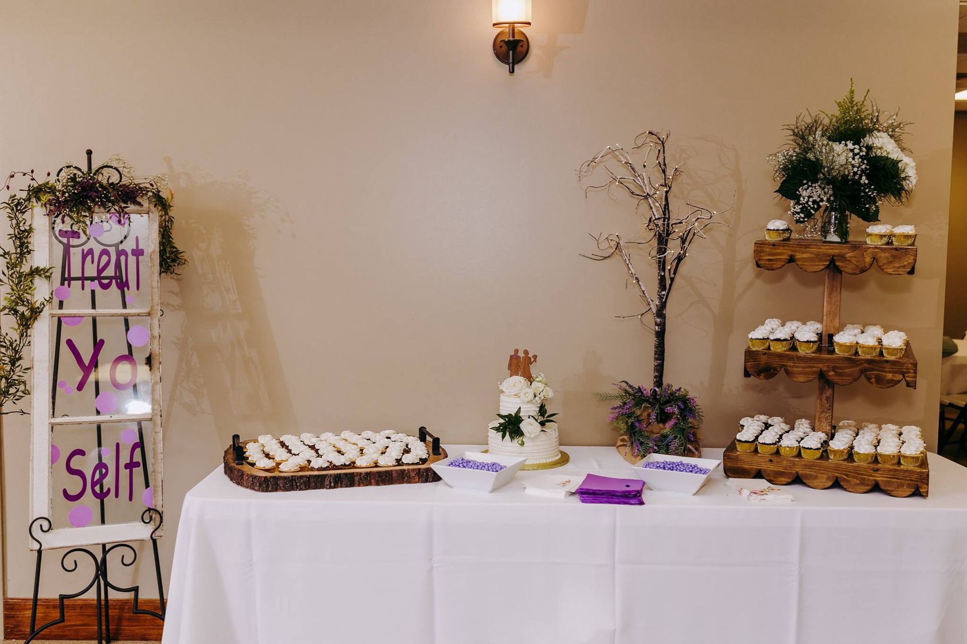 wedding cake and cupcakes