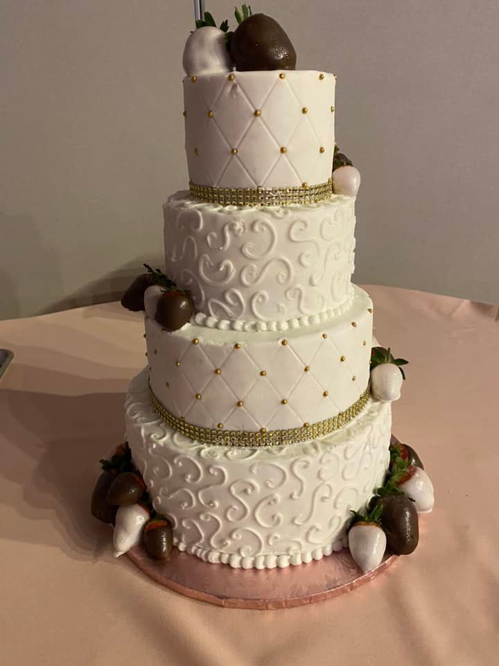 wedding cake with chocolate covered strawberries