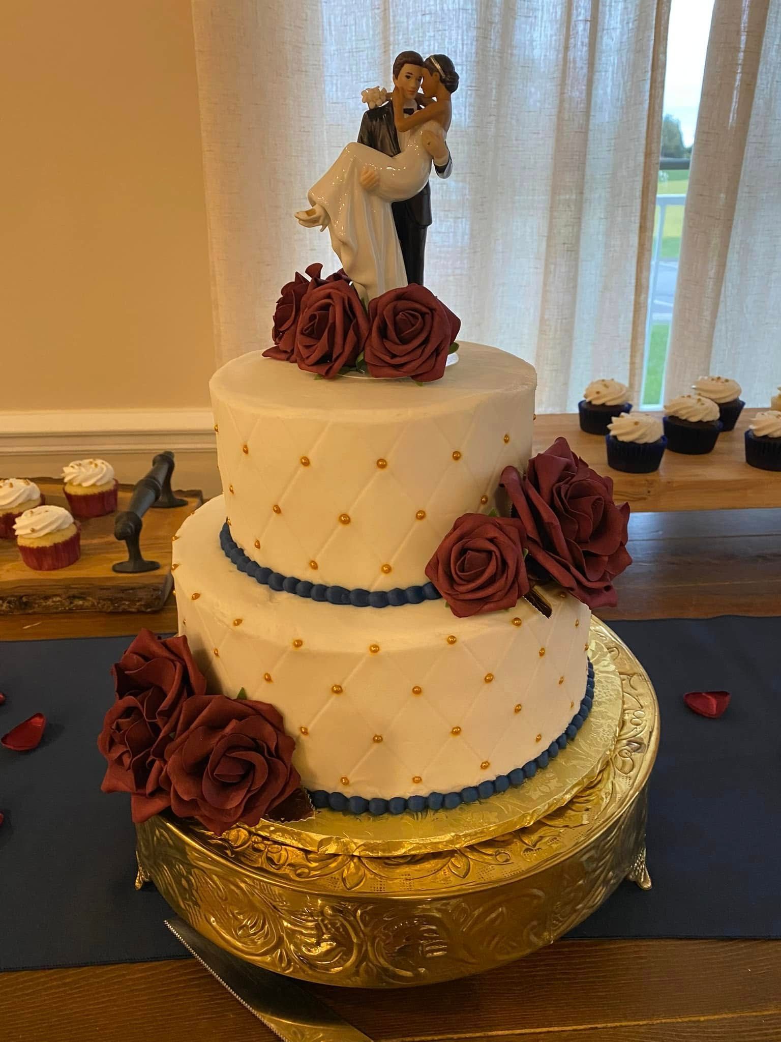 wedding cake with blue and gold details