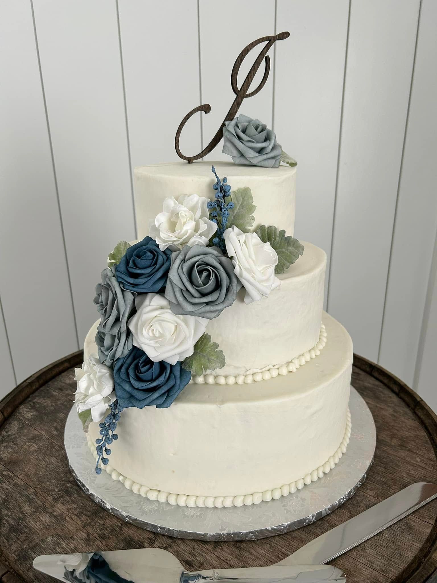 wedding cake with blue flowers