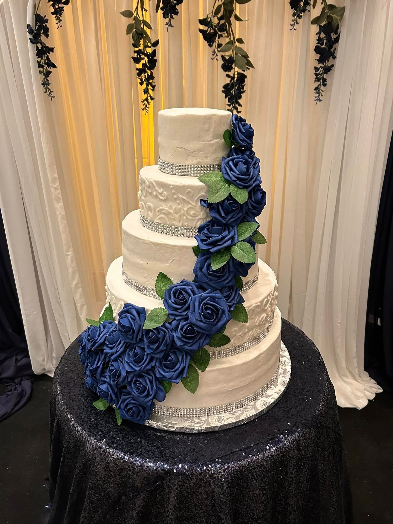 wedding cake with blue roses