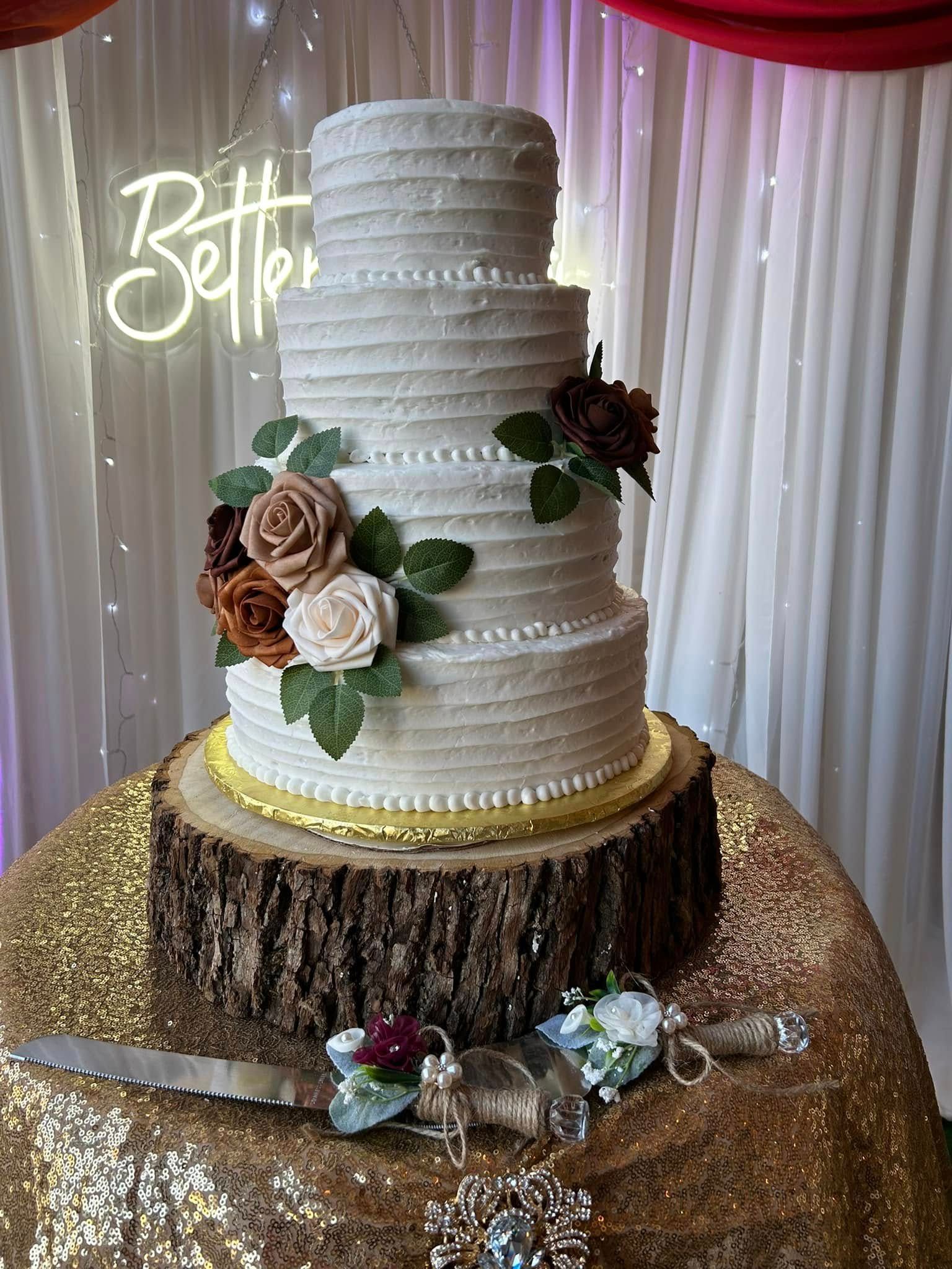 wedding cake on wooden cake stand
