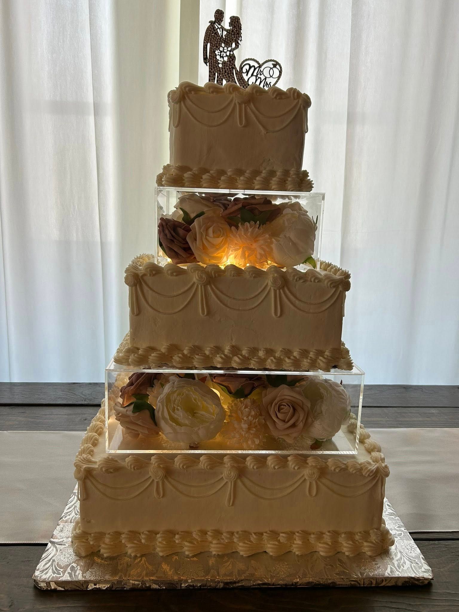 square wedding cake with floral tiers