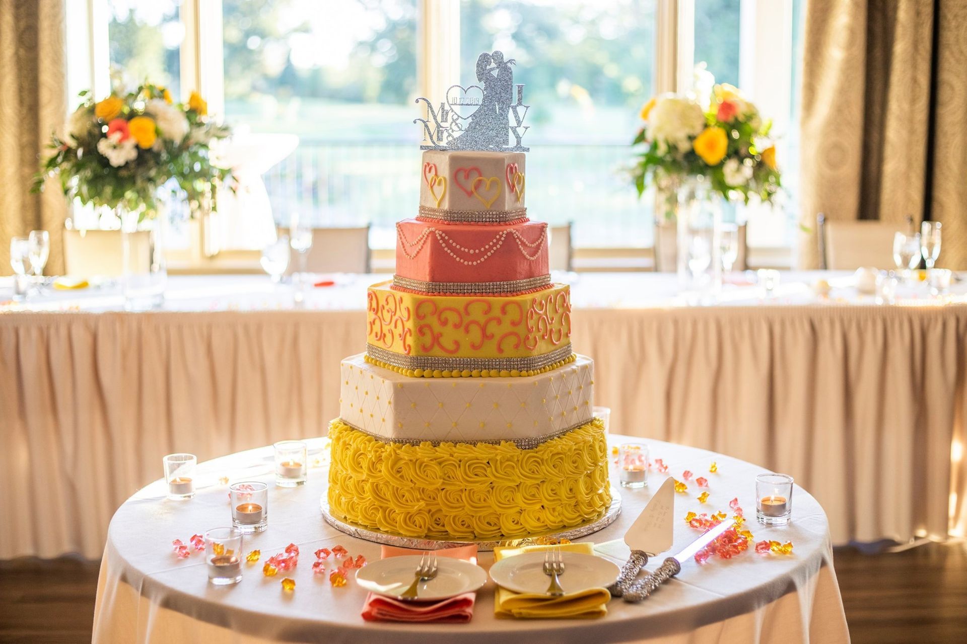 five tier pink and yellow birthday cake
