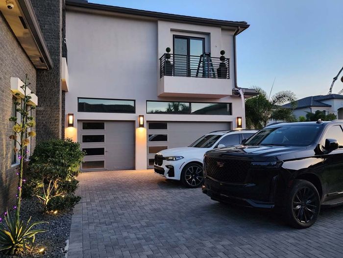 Beautiful House two luxury parked car