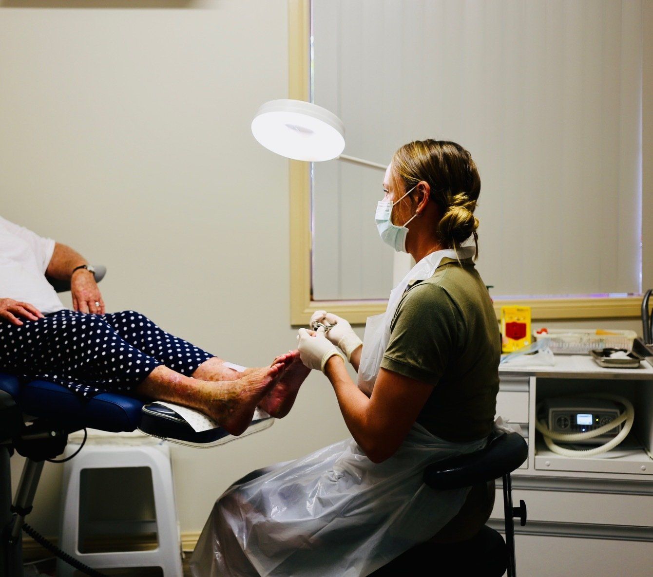 Doctor In Gloves During A Foot Treatment — Podiatry In Forster, NSW