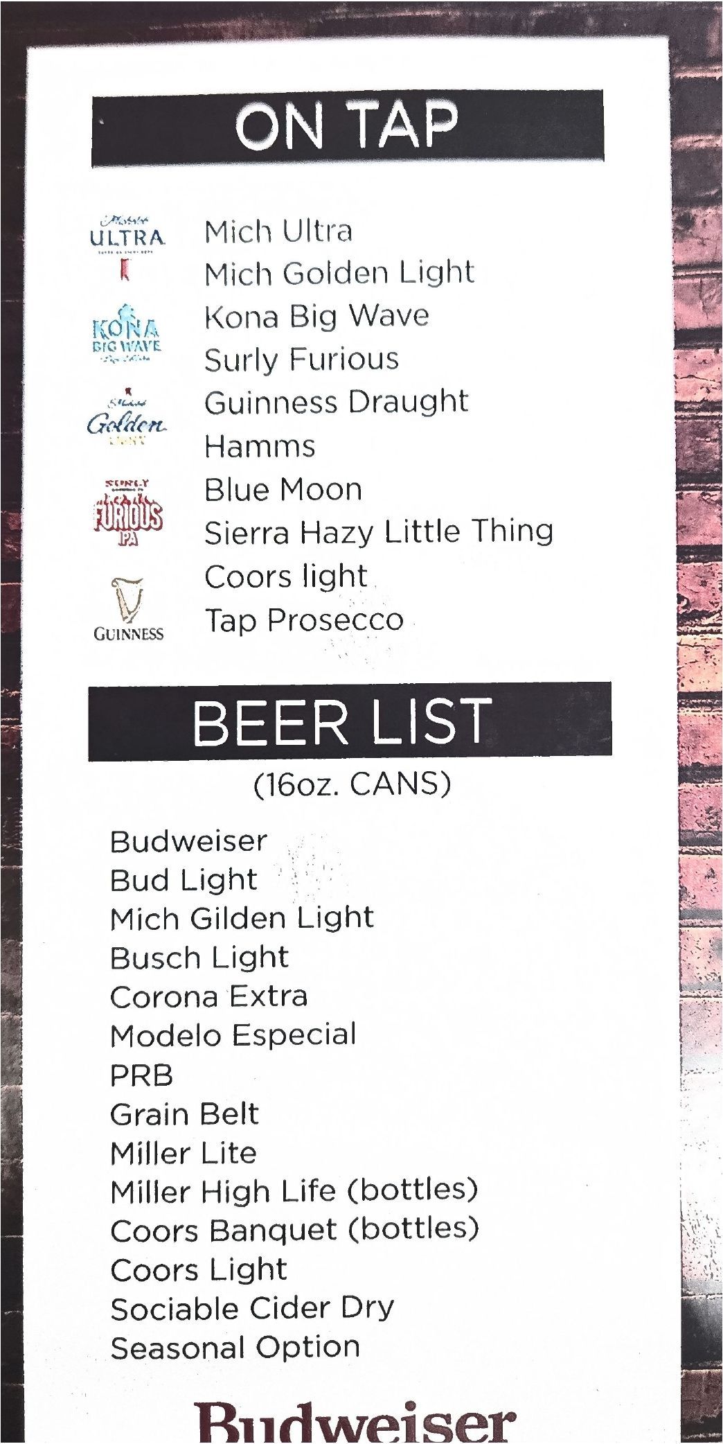 A vertical bar menu listing beers available on tap and in bottles, set against a dark brick background.