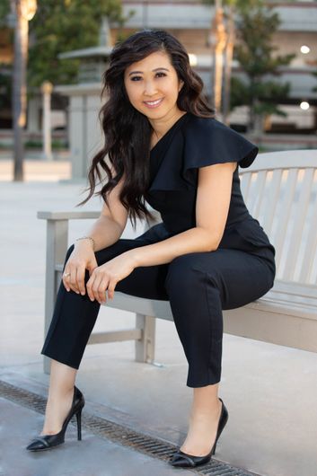 Lady sitting in a bench