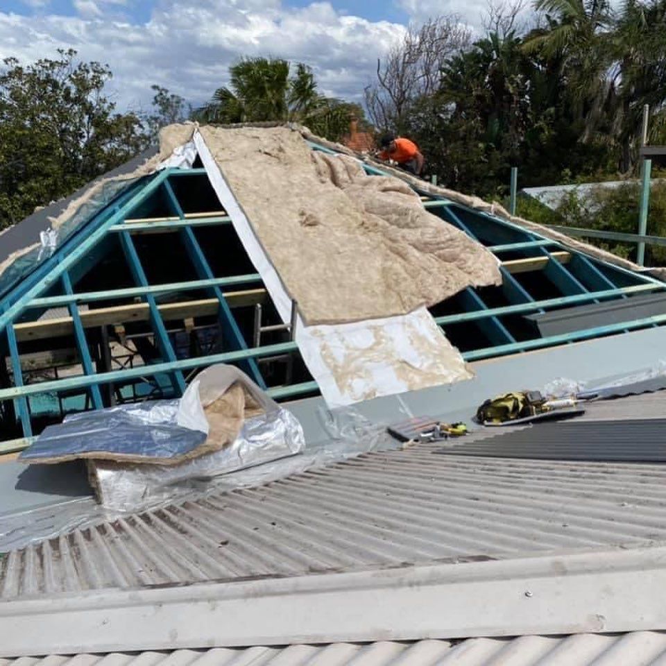A roof that is being built with a triangle shaped roof