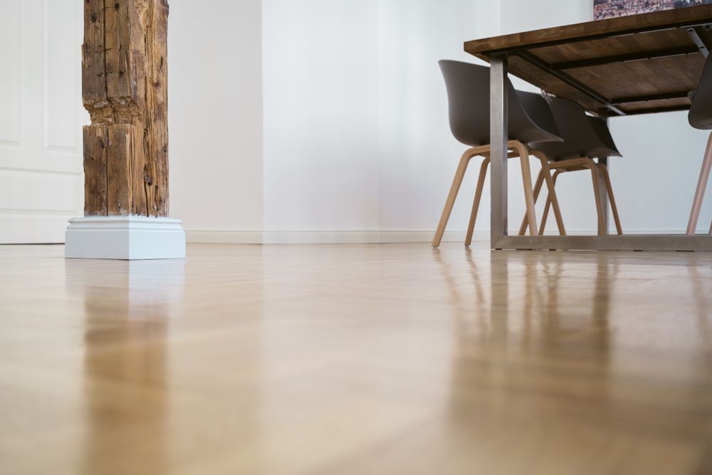 Low Angle View Of A Rustic Pillar Architectural Feature In The Dining Area Of A Home — B2B Flooring Solutions In Yamba, NSW