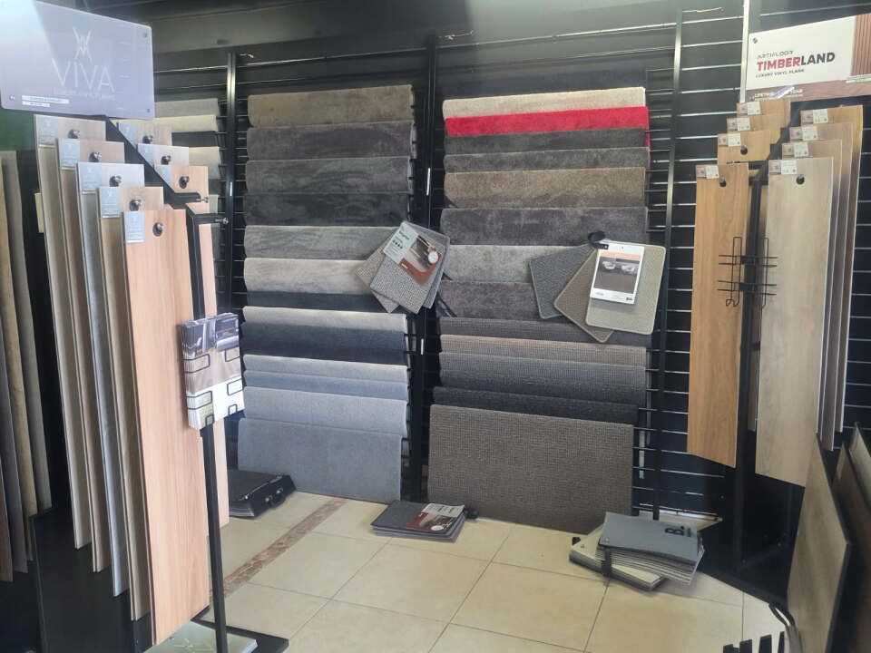 Handyman Installing New Laminated Wooden Floor — B2B Flooring Solutions In Coffs Harbour, NSW