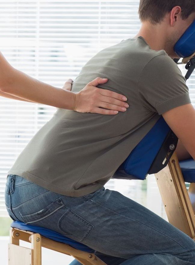 Chair massage to the neck, upper shoulders, back and upper back