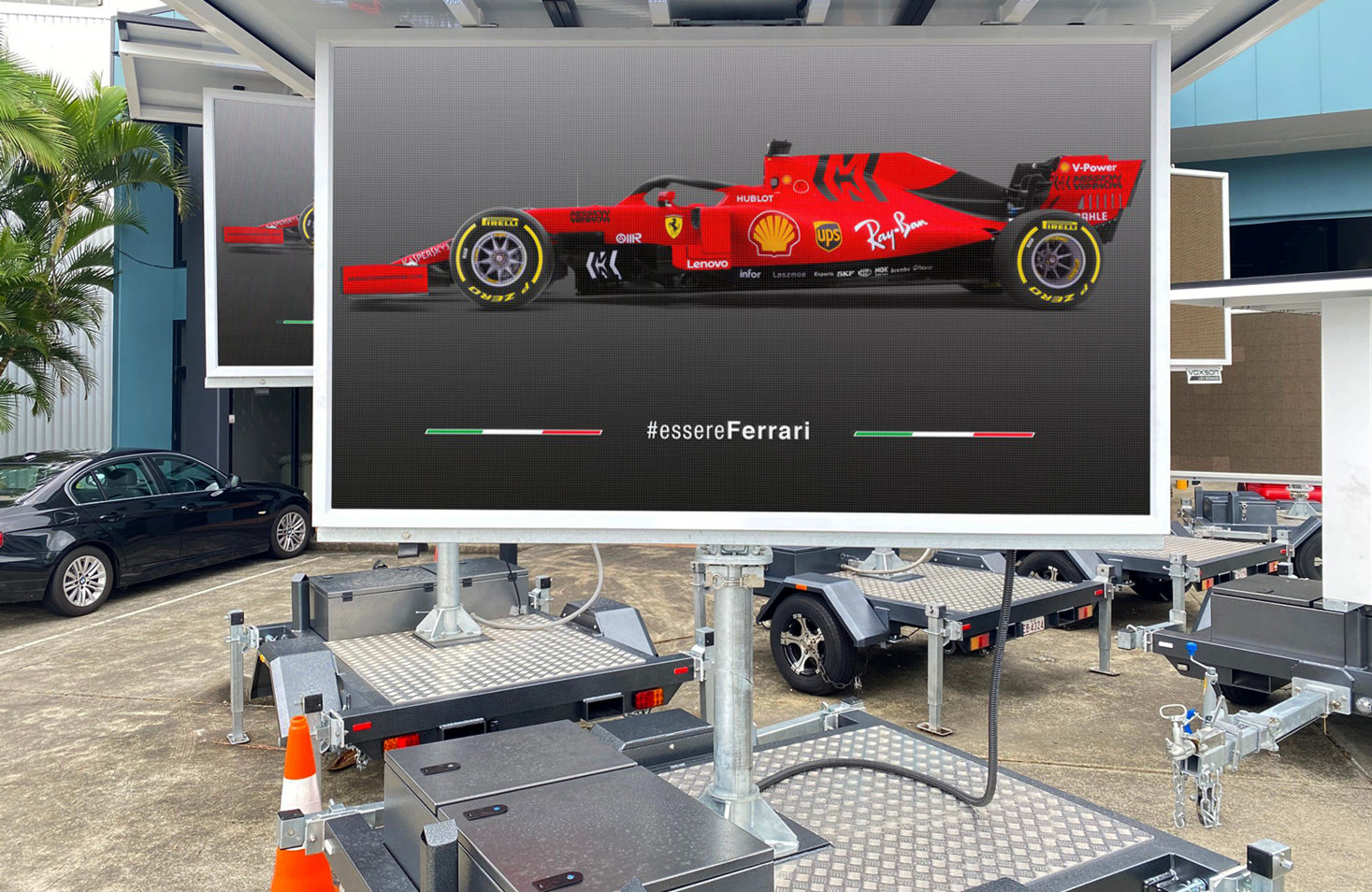 Mobile Billboard With A Ferrari Race Car On Display — HYVIS Plant Hire Pty Ltd in Mulambin, QLD