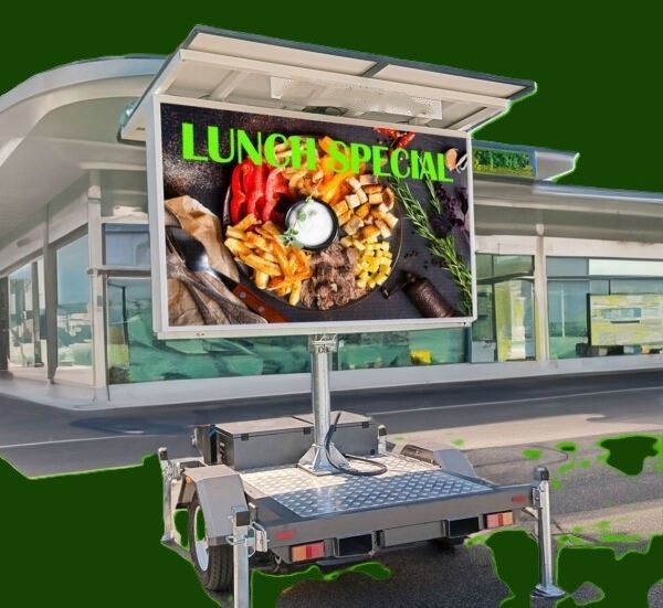 Two People Installing a Black Led Panel on an Outdoor Building Wall — HYVIS Plant Hire Pty Ltd in Mulambin, QLD