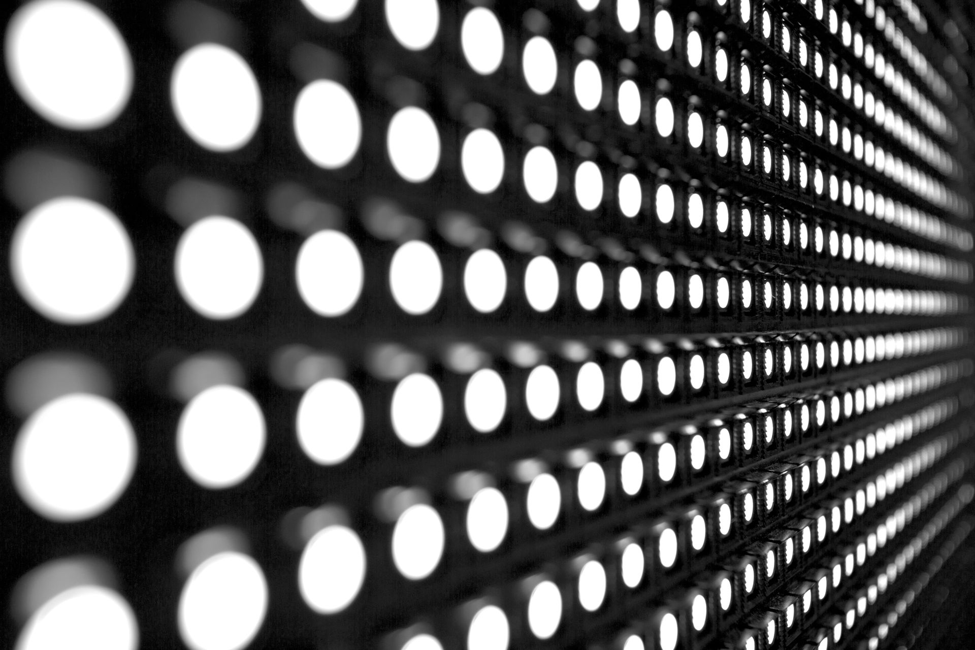 Rows of Bright White Lights Set in a Dark Perforated Panel — HYVIS Plant Hire Pty Ltd in Emu Park, QLD