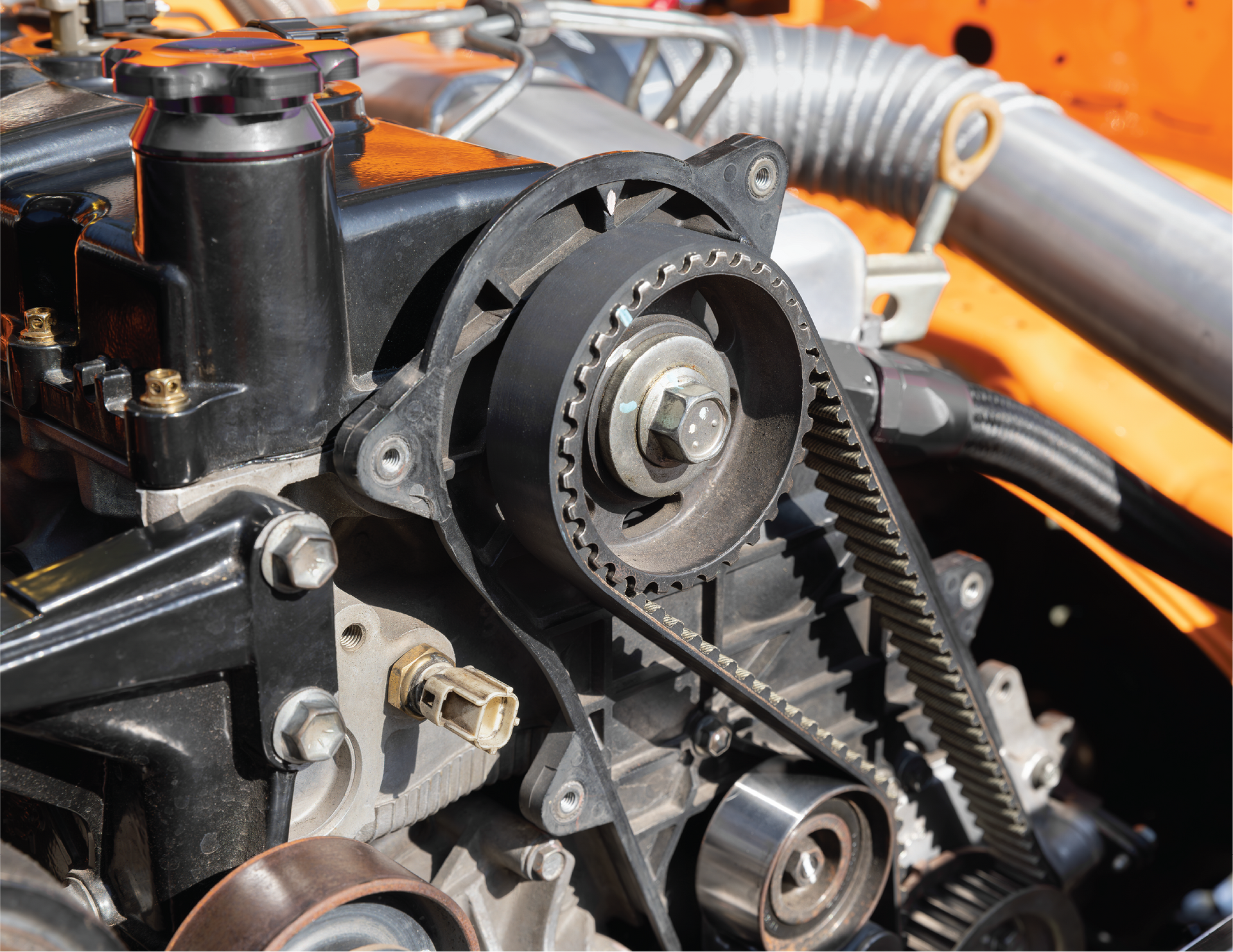 A man wearing gloves is working on a clutch disc