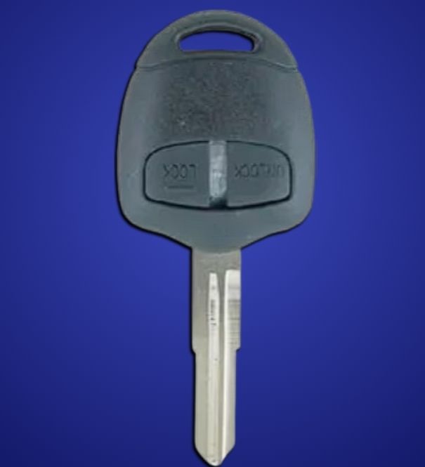 A person is holding two car keys in their hand in front of a car.