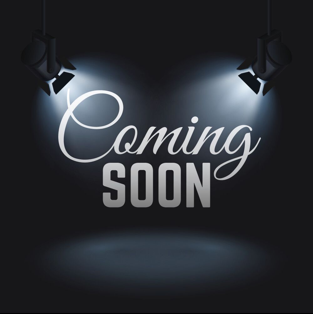 Two spotlights are shining on the word coming soon