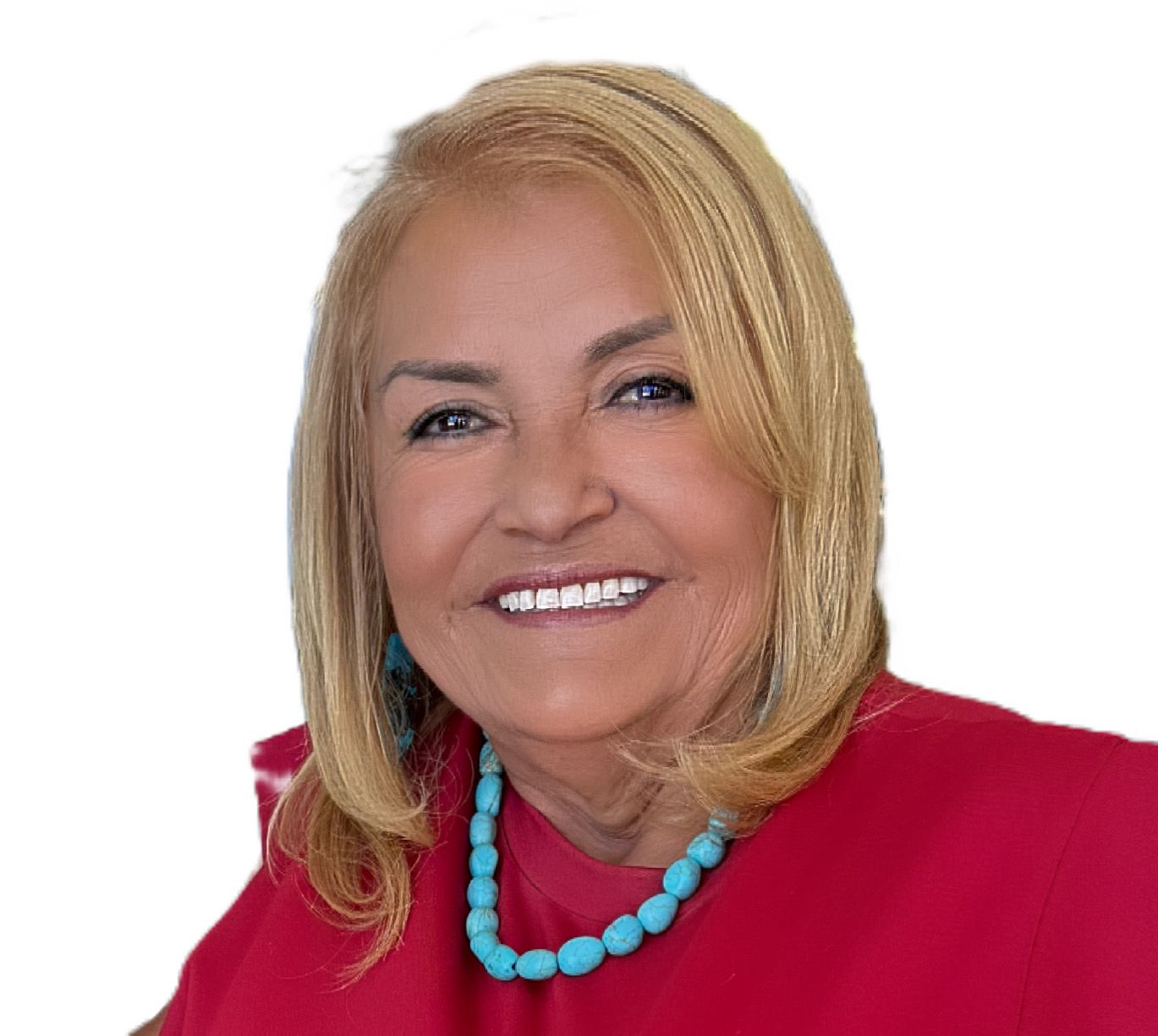 Woman with blonde hair wearing a red shirt and turquoise necklace smiles.