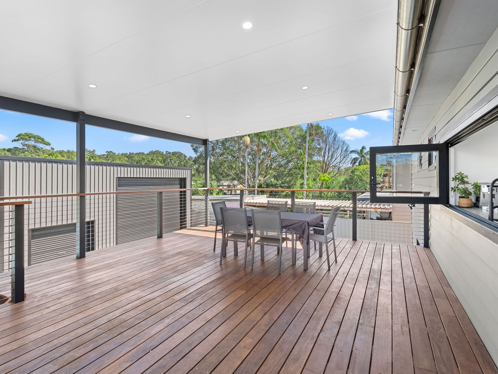 Cozy Rooftop Patio With String Lights, Hanging Chair — Wade Adams Constructions in Wingham, NSW