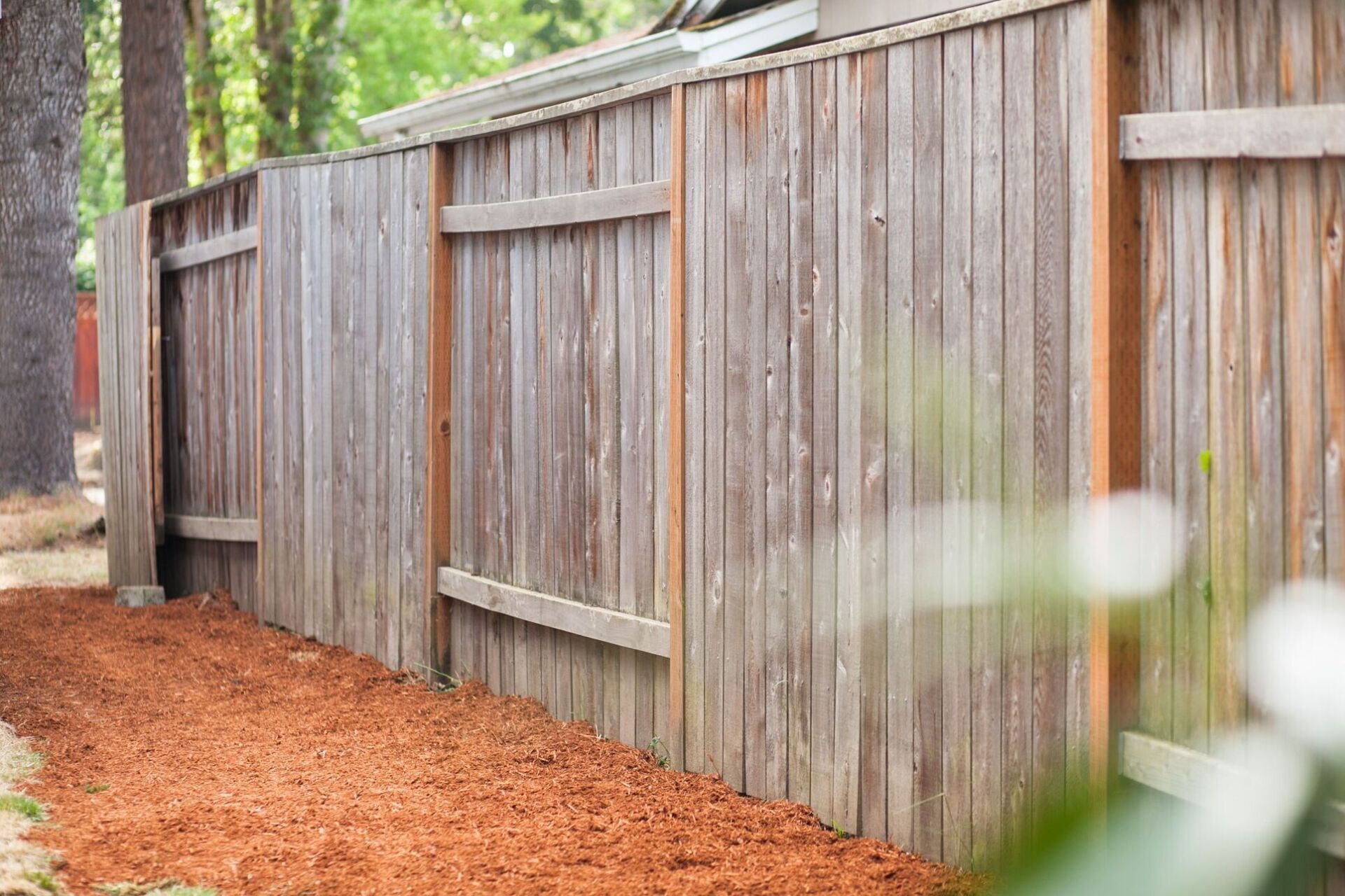 Freshly built wooden fence in backyard built by fence company Greensboro NC