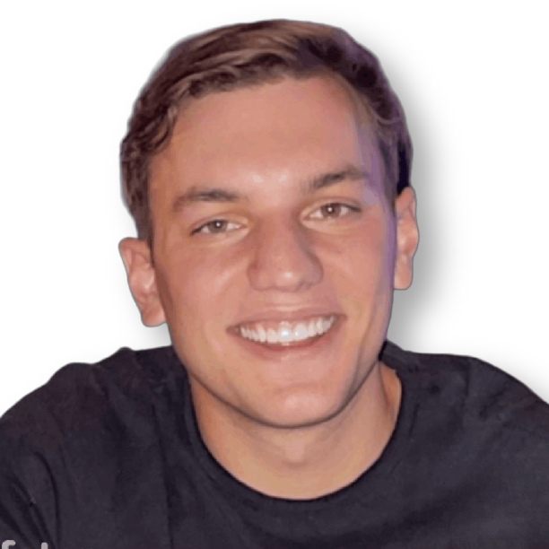 A young man wearing a black shirt is smiling for the camera