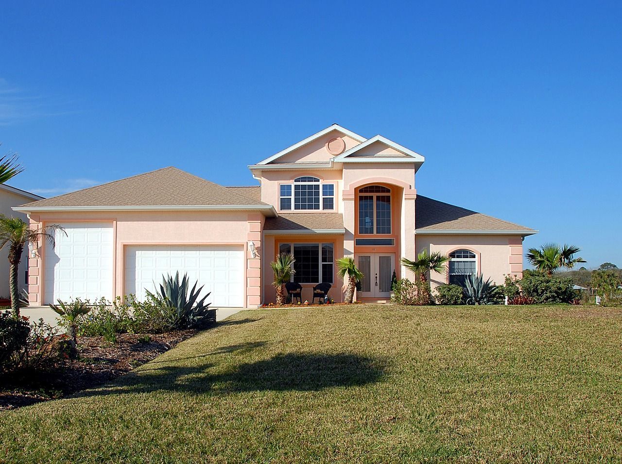 a large house with a lot of grass in front of it