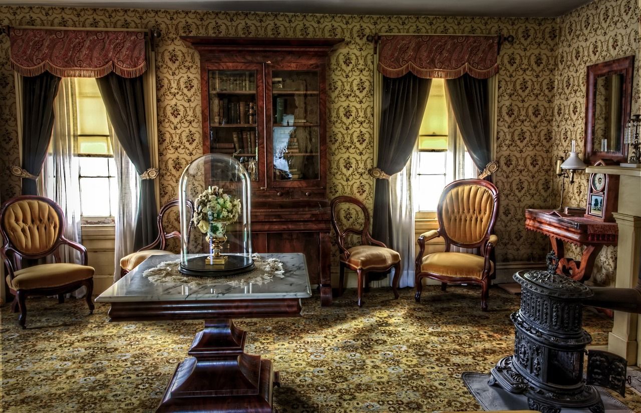 a living room with a table , chairs , and a stove 