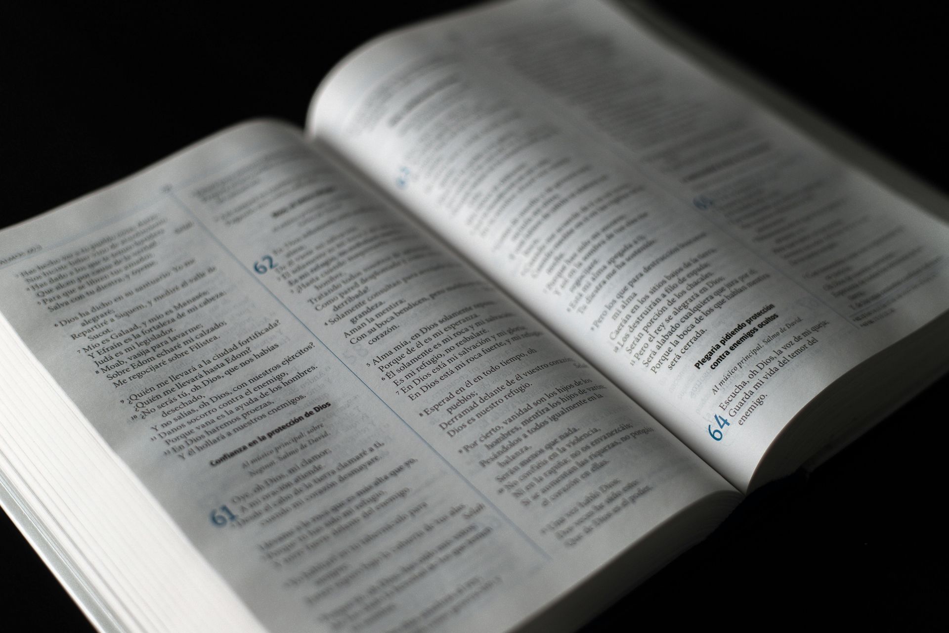 A close up of an open book on a table.