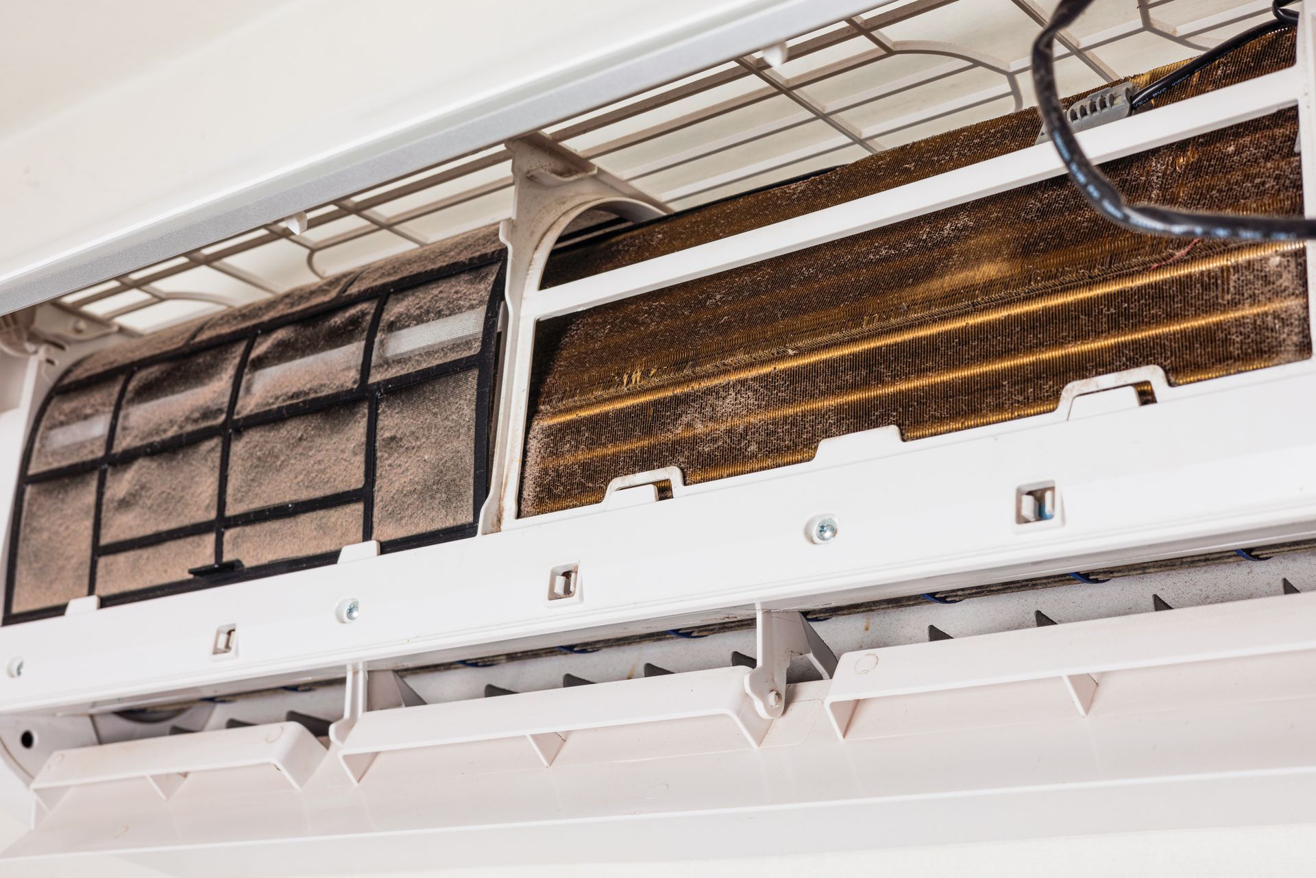 Dirty air conditioning unit with a clogged filter.