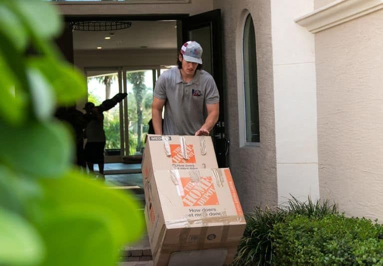 Labor-only movers lifting furniture in Miami
